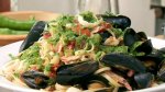 Fettuccine with fresh seafood and a green ...