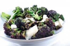 Steamed purple broccoli with goat's cheese